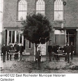Firemen with chemical carts.